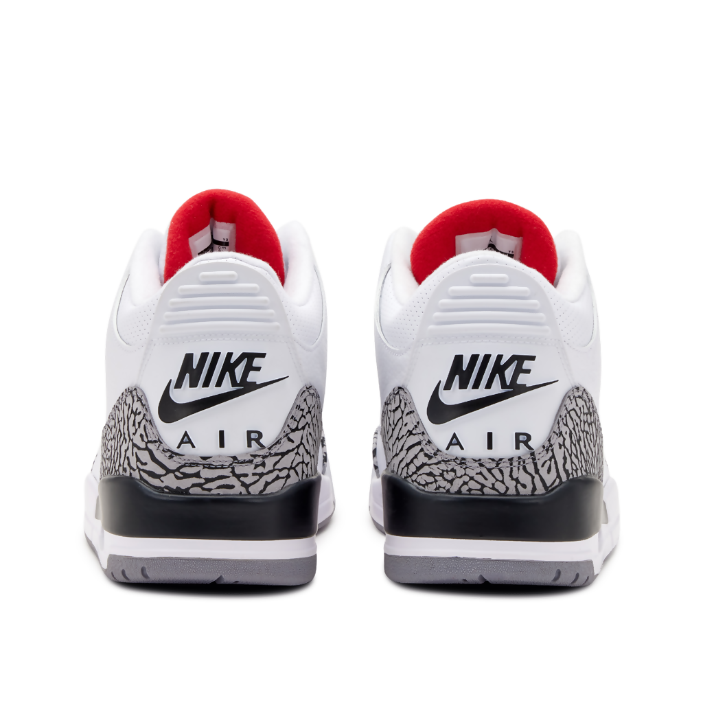Back view of Air Jordan 3 White Cement sneakers on white background showing Nike Air heel branding, elephant print overlay, and red collar lining