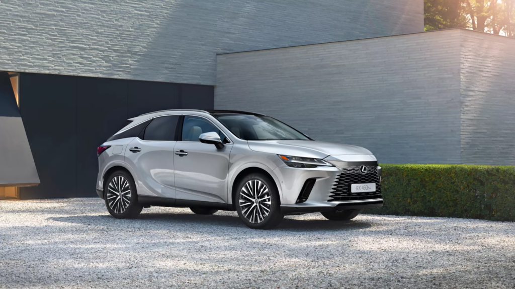 Best Luxury Hybrid SUV shown as a silver Lexus RX 450h luxury hybrid SUV parked on a modern minimalist driveway with soft morning light.