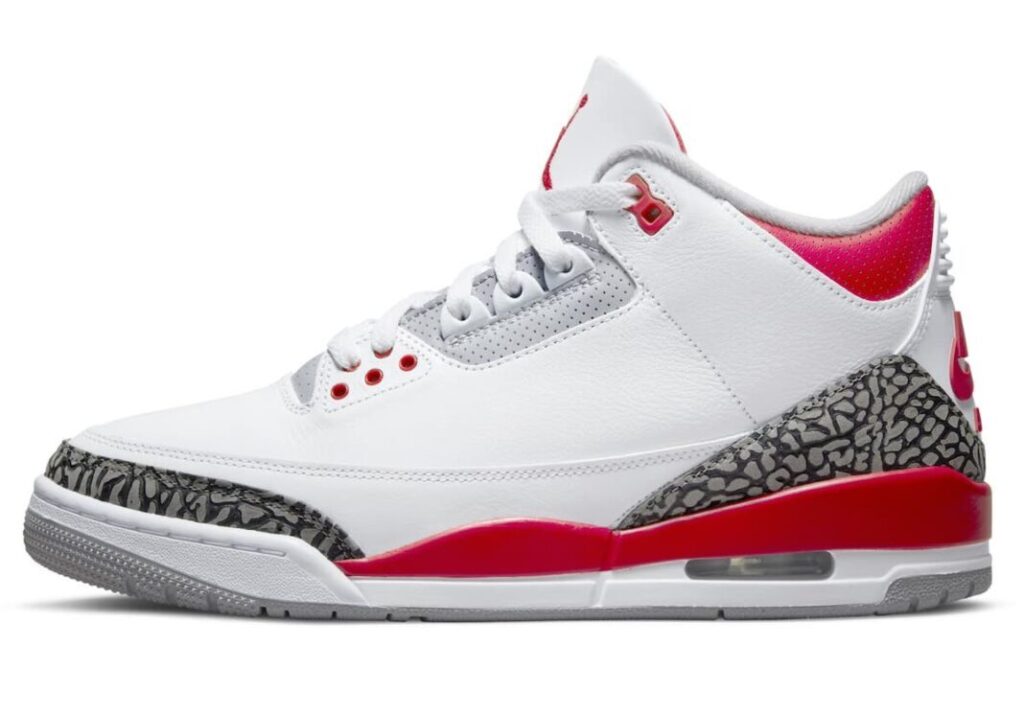 Air Jordan 3 sneaker in white with red accents and grey elephant print panels, side profile on a clean white background