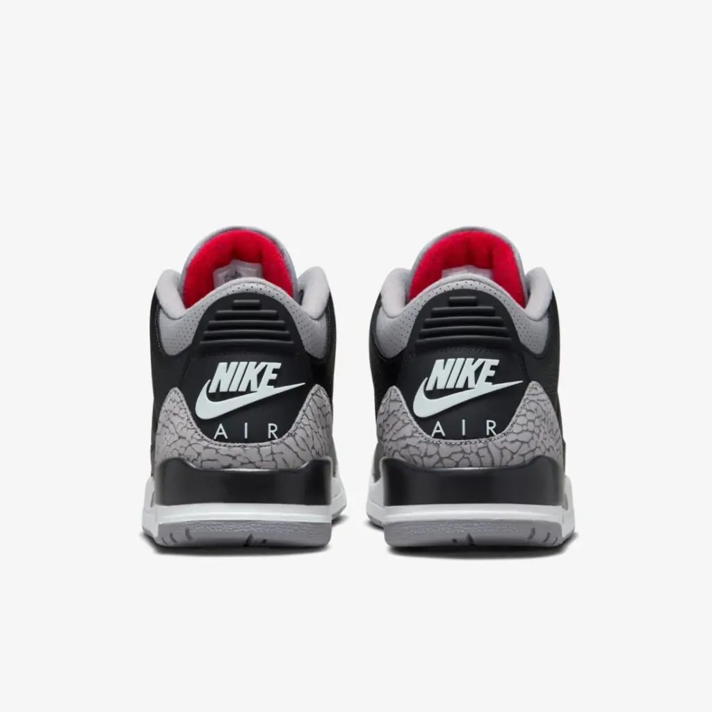 Rear view of the Air Jordan 3 Retro Black Cement pair showing black uppers, grey elephant print heel panels, red inner lining, and Nike Air branding on a white background